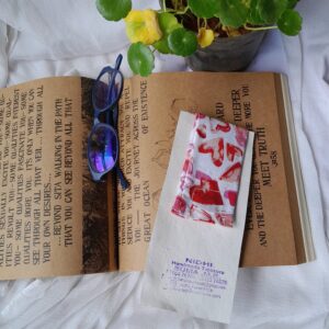 Handmade Fabric Bookmark - Red & White Heart Print A charming handmade fabric bookmark crafted with love, featuring a soft red and white floral pattern. Perfect for book lovers, gifting, journaling, and everyday reading moments.